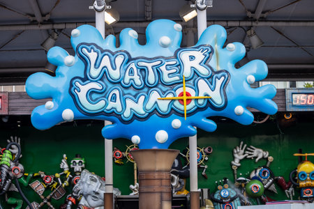 Tokyo, Japan, November 2, 2023: Colorful Water Cannon game sign at amusement parkのeditorial素材