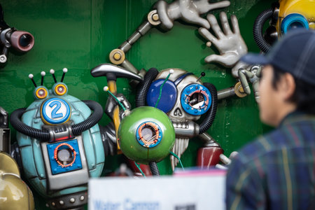 Tokyo, Japan, November 2, 2023: Colorful Robot Sculptures in a Store Windowのeditorial素材