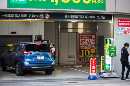 Tokyo, Japan, November 2, 2023: Underground car park entrance with a vehicle in Tokyo