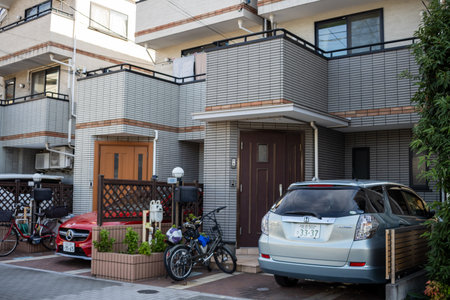Tokyo, Japan, November 2, 2023: Residential area with parked bicycles and a carのeditorial素材