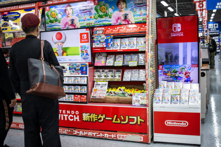 Tokyo, Japan, November 2, 2023: Person browsing Nintendo Switch games at a retail storeのeditorial素材