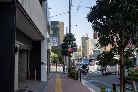 Tokyo, Japan, November 2, 2023: Urban street scene with pedestrians and traffic in Tokyoのeditorial素材