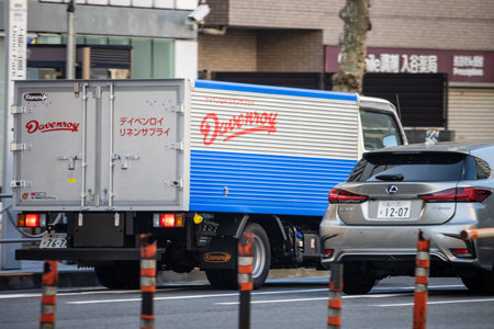 Tokyo, Japan, November 2, 2023: Delivery trucks and cars on a busy streetのeditorial素材