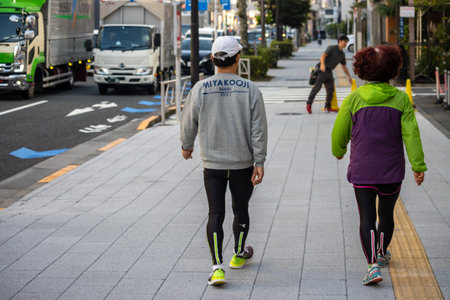 Tokyo, Japan, November 2, 2023: Pedestrians Walking on City Streetのeditorial素材