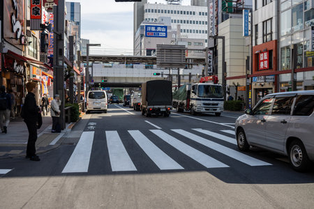 Tokyo, Japan, November 2, 2023: Busy street scene with pedestrian crossing and urban trafficのeditorial素材