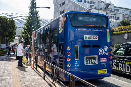 Tokyo, Japan, November 2, 2023: City Bus with Passengers Boardingのeditorial素材