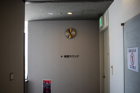 Tokyo, Japan, November 2, 2023: Interior Hallway with Clock and Exit Signのeditorial素材