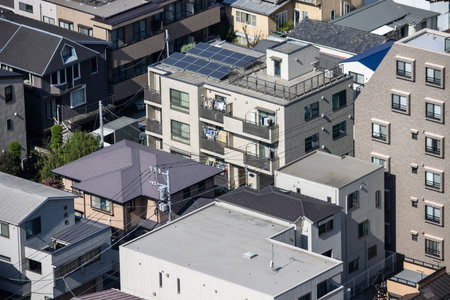 Tokyo, Japan, November 2, 2023: High-Angle View of Solar Panels on City Buildingsのeditorial素材