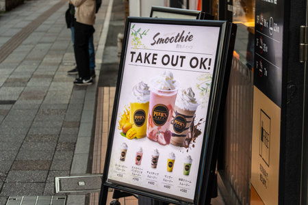 Tokyo, Japan, November 3, 2023: Advertisement for Smoothie Take-Out in front of a cafeのeditorial素材
