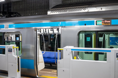Tokyo, Japan, November 3, 2023: Train at a Station Platform with Open Doors