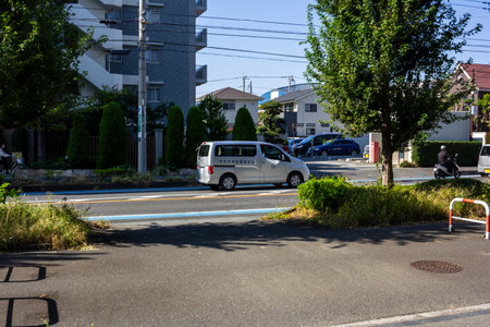 Tokyo, Japan, November 3, 2023: Street view with vehicles and residential buildingsのeditorial素材