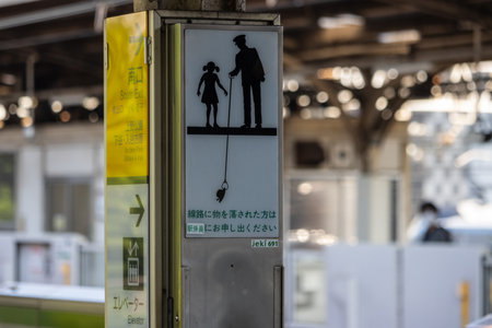 Tokyo, Japan, November 3, 2023: Pedestrian Crossing Sign with Construction Worker Silhouettes