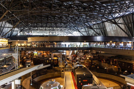 Tokyo, Japan, November 3, 2023: Interior view of a busy train station with travelers and trainsのeditorial素材