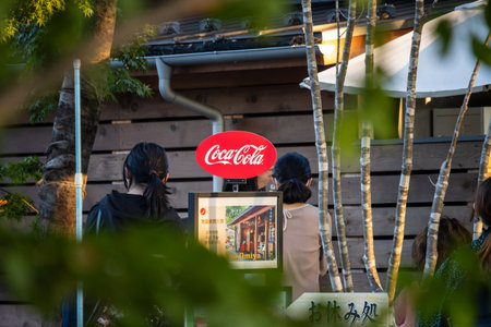 Tokyo, Japan, November 3, 2023: Outdoor Coca-Cola Advertisement in a Bustling Areaのeditorial素材
