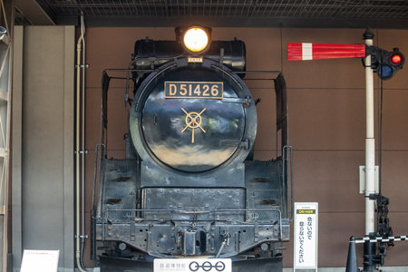 Tokyo, Japan, November 3, 2023: Front view of a classic black steam locomotive at railway museumのeditorial素材