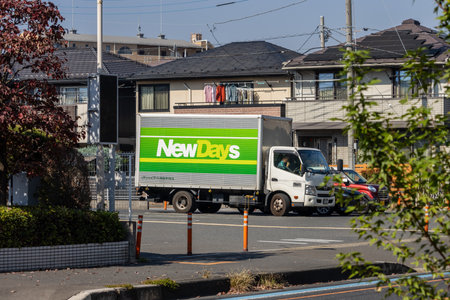 Tokyo, Japan, November 3, 2023: NewDays convenience store truck on urban streetのeditorial素材