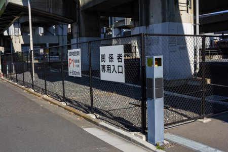 Tokyo, Japan, November 3, 2023: Parking lot entrance with signage under the expresswayのeditorial素材