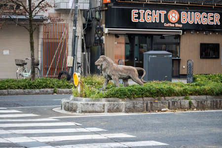 Tokyo, Japan, November 3, 2023: Statue of a lion in front of Eight Burger coffee shopのeditorial素材