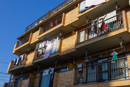 Tokyo, Japan, November 3, 2023: Apartment Balconies with Laundry Hanging Outdoorsのeditorial素材