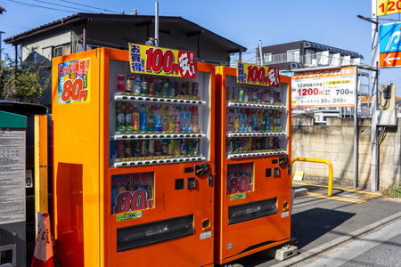 Tokyo, Japan, November 3, 2023: Vibrant beverage vending machines on city sidewalkのeditorial素材