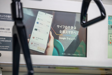 Tokyo, Japan, November 3, 2023: Advertisement screen displaying Google Translate app inside a trainのeditorial素材