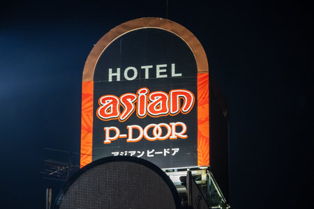 Tokyo, Japan, November 3, 2023: Illuminated sign of Hotel Asian P-Door at nightのeditorial素材