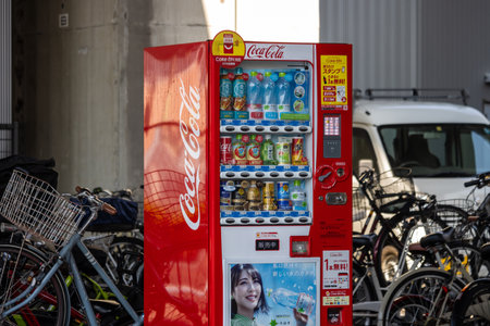 Tokyo, Japan, November 3, 2023: Coca-Cola vending machine among bicyclesのeditorial素材