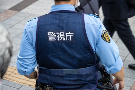 Tokyo, Japan, October 31, 2023: Security Officer Patrolling in Tokyoのeditorial素材