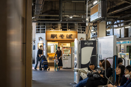 Tokyo, Japan, November 3, 2023: Passengers waiting and using vending machines at train stationのeditorial素材