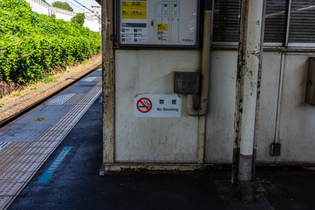 Tokyo, Japan, November 3, 2023: Train station platform with no smoking signのeditorial素材