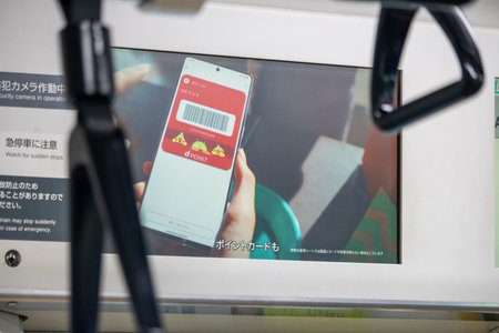 Tokyo, Japan, November 3, 2023: Advertisement for app-based service viewed through bus windowのeditorial素材
