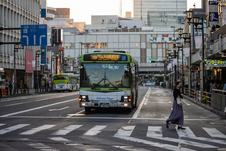 Tokyo, Japan, November 3, 2023: City bus approaching a pedestrian crossingのeditorial素材