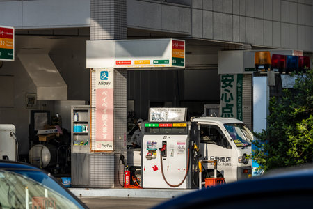 Tokyo, Japan, November 3, 2023: ENEOS gas station with customer service in urban settingのeditorial素材