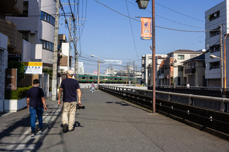 Tokyo, Japan, November 3, 2023: Pedestrians walking near Kugayama Station on a sunny dayのeditorial素材