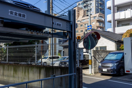 Tokyo, Japan, November 3, 2023: Street view with residential buildings and parking lot entrance