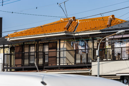Tokyo, Japan, November 3, 2023: Traditional Japanese House with Orange Tiled Roofのeditorial素材