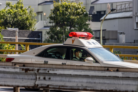 Tokyo, Japan, November 4, 2023: Japanese Police Car on Duty in the City