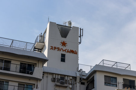 Tokyo, Japan, November 4, 2023: Star-Emblazoned Building Sign in Japanese Charactersのeditorial素材
