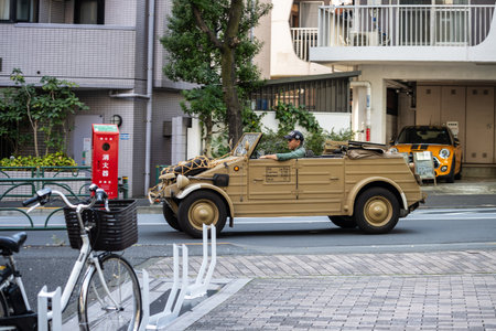 Tokyo, Japan, November 4, 2023: Vintage Military Vehicle in Motion on Tokyo Streetsのeditorial素材