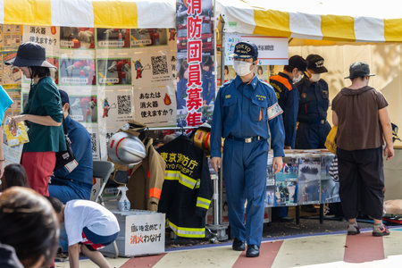 Tokyo, Japan, November 4, 2023: Japanese Firefighter in Uniform Patrolling a Local Eventのeditorial素材