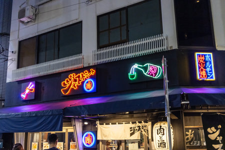 Tokyo, Japan, November 4, 2023: Vibrant Neon Signs on Traditional Japanese Izakayaのeditorial素材