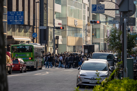 Tokyo, Japan, November 4, 2023: Bustling Street Scene with Pedestrians and Public Transportation in Shibuyaのeditorial素材
