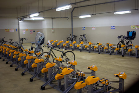 Tokyo, Japan, November 4, 2023: Organized Indoor Bicycle Parking Facility with Numbered Yellow Bike Standsのeditorial素材