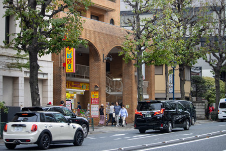 Tokyo, Japan, November 4 2023: City street scene with pedestrians and carsのeditorial素材