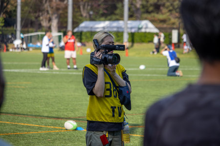 Tokyo, Japan, November 4, 2023: Camerawoman Filming Soccer Match