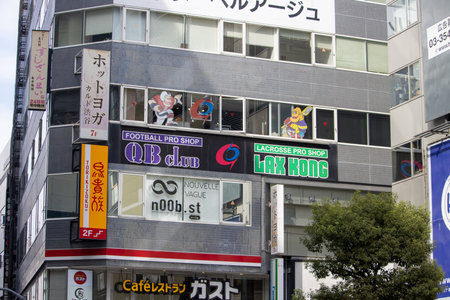 Tokyo, Japan, November 4 2023: Urban Storefronts with Various Shop Signsのeditorial素材