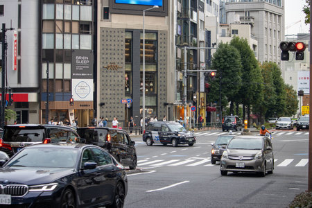 Tokyo,Japan, November 4 2023: Busy Intersection in Tokyo with Pedestrians and Trafficのeditorial素材