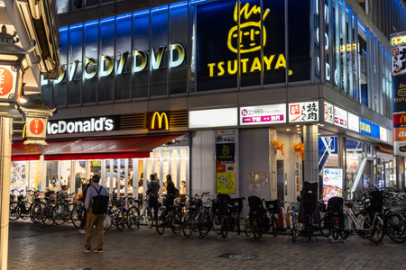 Tokyo, Japan, November 5 2023: Night View of a Busy Street with Prominent Fast-Food Outletsのeditorial素材