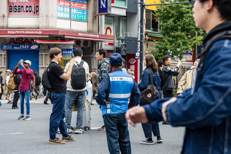 Tokyo, Japan, November 5, 2023: Busy Street Scene with Pedestrians and Signageのeditorial素材