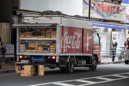 Tokyo, Japan, November 5 2023: Coca-Cola Delivery Truck in Urban Settingのeditorial素材